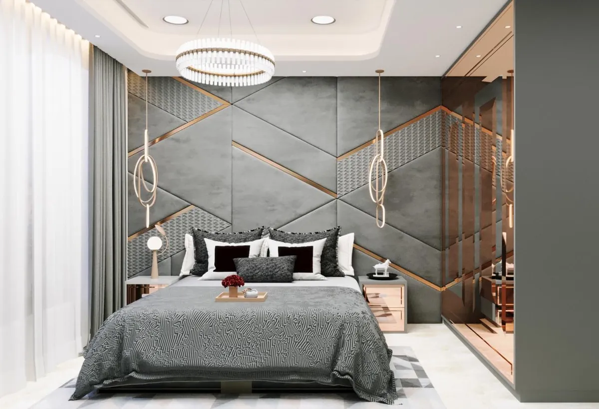 Bedroom with geometric grey upholstered wall panels, rose-gold strips and ring pendants