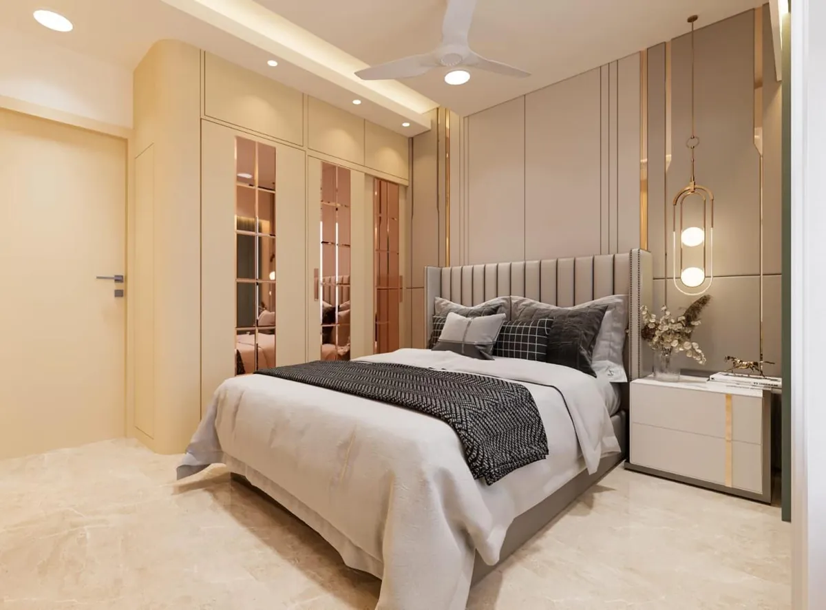 Bedroom with bronze-mirror wardrobe shutters and channel-tufted grey headboard