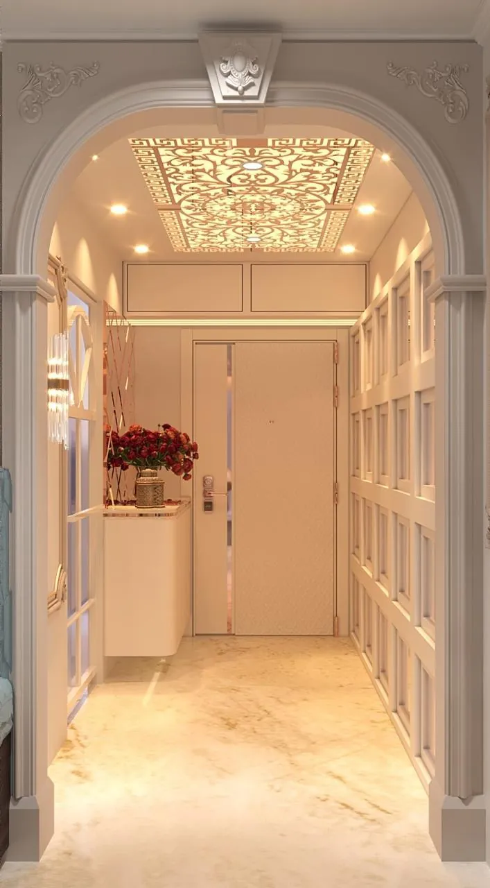 Classical entrance foyer with moulded arch, carved backlit ceiling and panelled walls