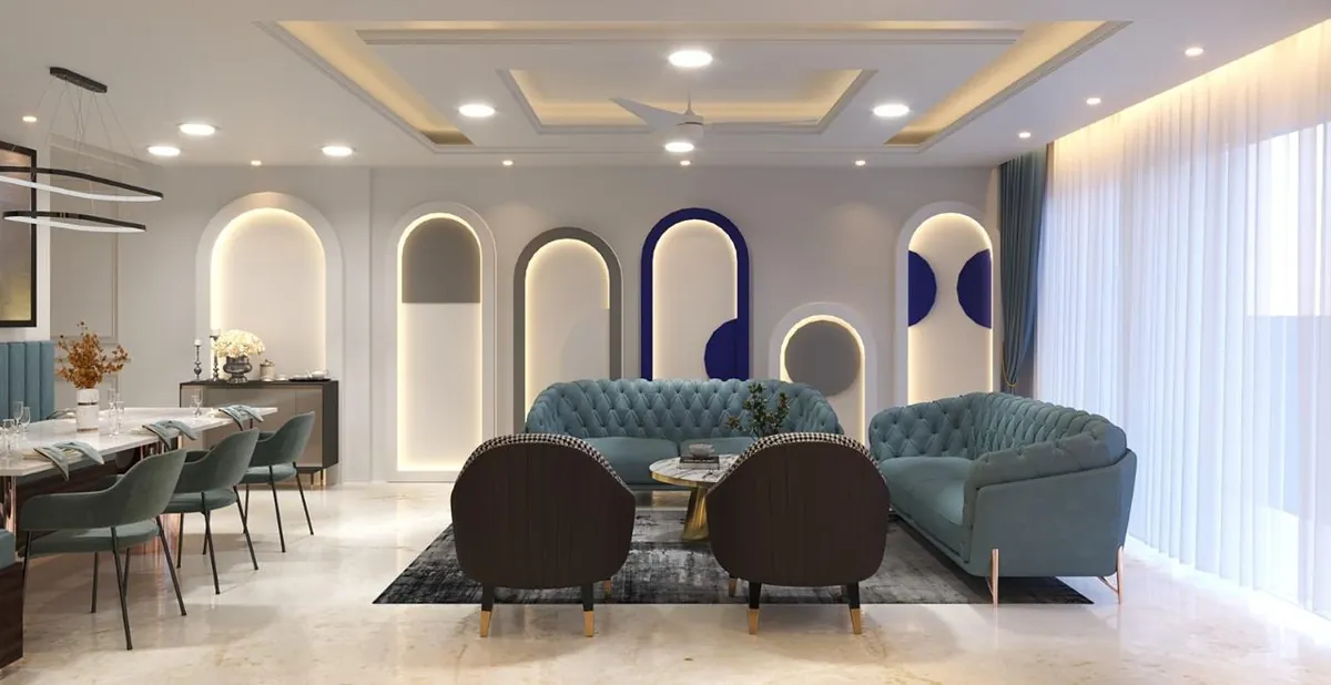 Living and dining room with backlit arch wall niches, tufted blue sofas and dining table